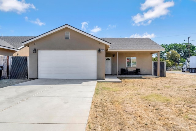 22375 Fairmead Cir, Chowchilla, CA 93610 - ranch-style house featuring a garage, stucco siding, concrete driveway, and roof with shingles