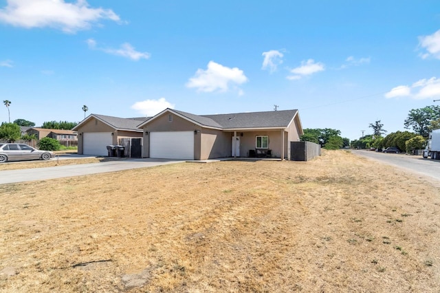 22375 Fairmead Cir, Chowchilla, CA 93610 - single story home featuring concrete driveway, a garage, and stucco siding