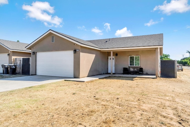 22375 Fairmead Cir, Chowchilla, CA 93610 - ranch-style house with an attached garage, stucco siding, and concrete driveway