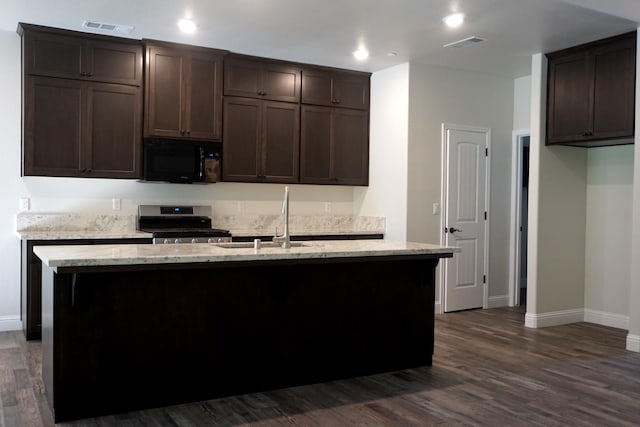 29030 Yosemite Springs Pkwy, Coarsegold, CA 93614 - kitchen featuring black microwave, stainless steel range oven, baseboards, dark wood-type flooring, and recessed lighting