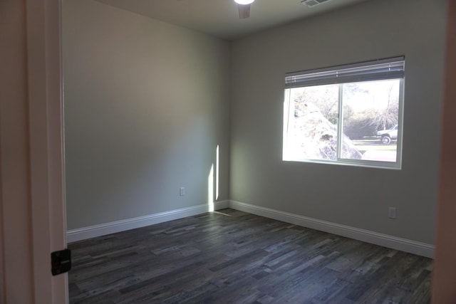 29030 Yosemite Springs Pkwy, Coarsegold, CA 93614 - unfurnished room featuring dark wood-style floors, ceiling fan, and baseboards