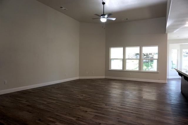 29030 Yosemite Springs Pkwy, Coarsegold, CA 93614 - unfurnished room with a ceiling fan, dark wood-style floors, and baseboards