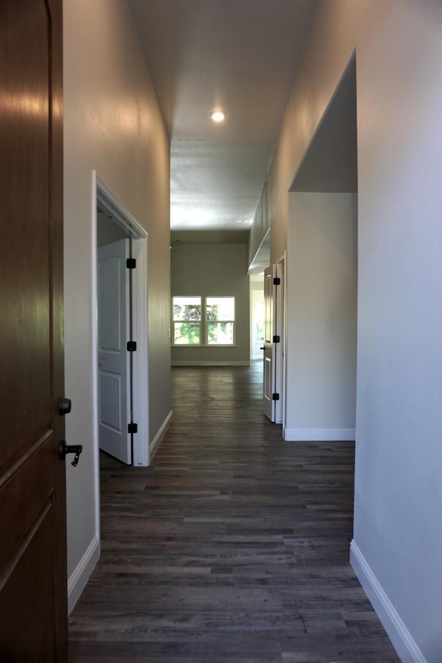 29030 Yosemite Springs Pkwy, Coarsegold, CA 93614 - hallway with dark wood-style flooring, baseboards, and recessed lighting