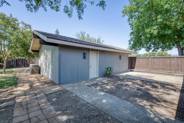 1904 S Fairway Ave, Fresno, CA 93727 - exterior space with a patio, a fenced backyard, an outbuilding, and central AC unit