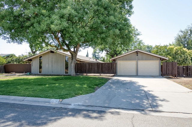 1904 S Fairway Ave, Fresno, CA 93727 - view of front facade with a garage, concrete driveway, and board and batten siding