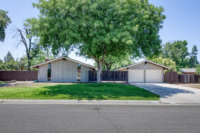 1904 S Fairway Ave, Fresno, CA 93727 - mid-century modern home with driveway and a garage