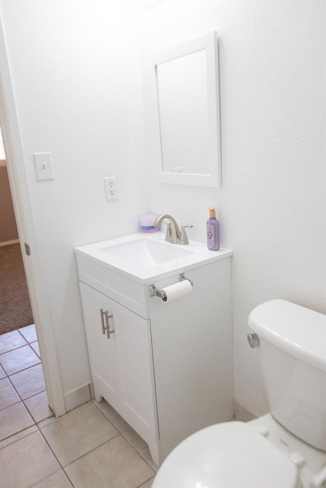 3870 N Fordham Ave, Fresno, CA 93727 - half bathroom featuring vanity, toilet, and tile patterned flooring
