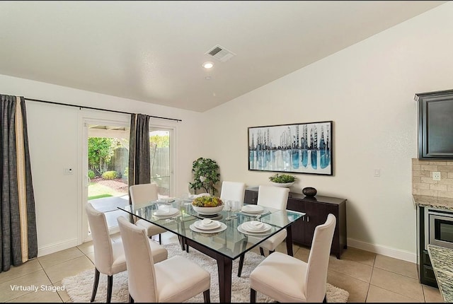 461 S Cascade Way, Madera, CA 93636 - dining space with vaulted ceiling and light tile patterned floors