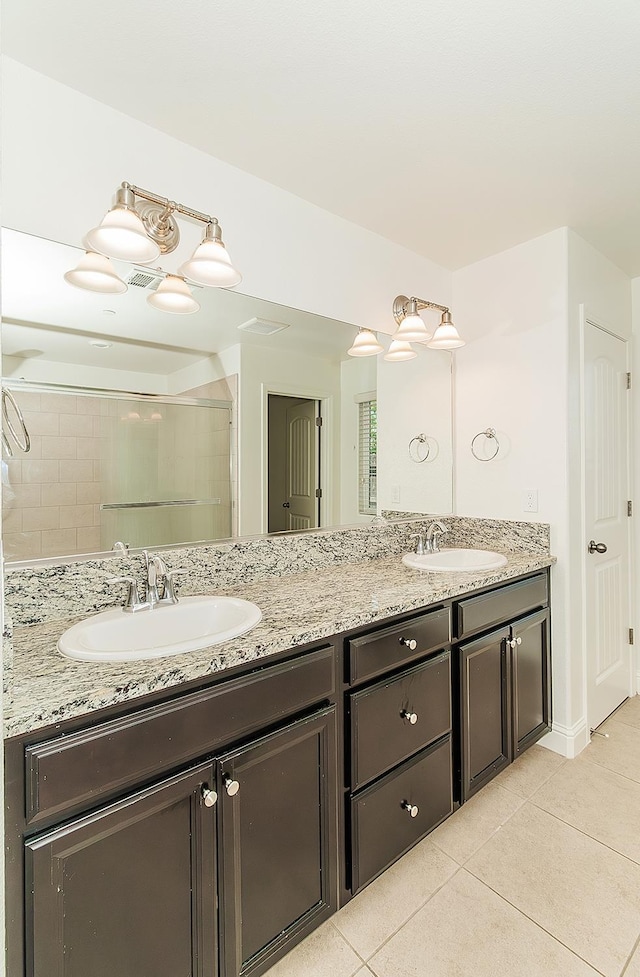 461 S Cascade Way, Madera, CA 93636 - full bathroom with double vanity and tile patterned flooring