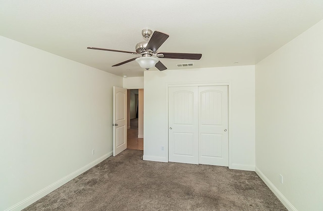 461 S Cascade Way, Madera, CA 93636 - unfurnished bedroom featuring carpet, a closet, and a ceiling fan