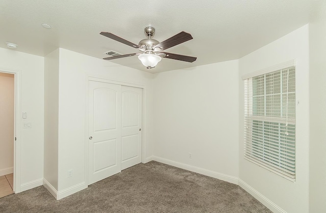 461 S Cascade Way, Madera, CA 93636 - unfurnished bedroom featuring carpet flooring, a closet, and ceiling fan