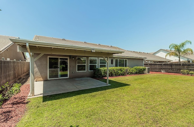 461 S Cascade Way, Madera, CA 93636 - back of property with stucco siding, a fenced backyard, and a patio