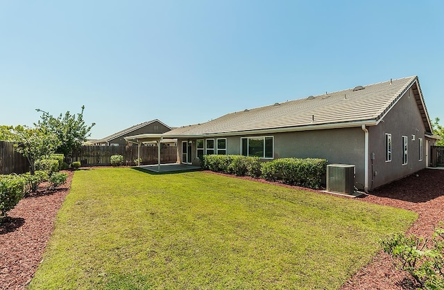 461 S Cascade Way, Madera, CA 93636 - rear view of property featuring a fenced backyard, stucco siding, a patio area, and a tile roof