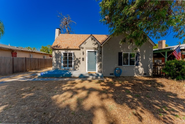 963 N Arthur Ave, Fresno, CA 93728 - view of front of home featuring stucco siding and a chimney