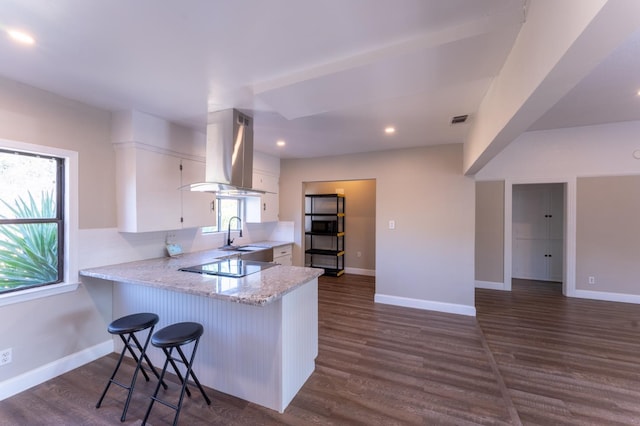 963 N Arthur Ave, Fresno, CA 93728 - kitchen with island range hood, white cabinetry, a peninsula, black electric stovetop, and dark wood finished floors