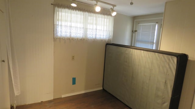 1625 N Woodson Ave, Fresno, CA 93705 - empty room with wood finished floors and track lighting