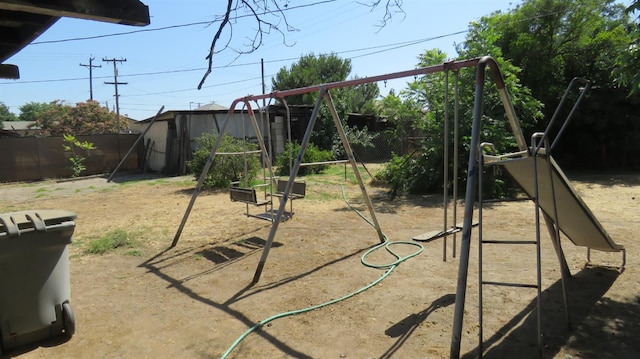 1625 N Woodson Ave, Fresno, CA 93705 - view of jungle gym with a fenced backyard