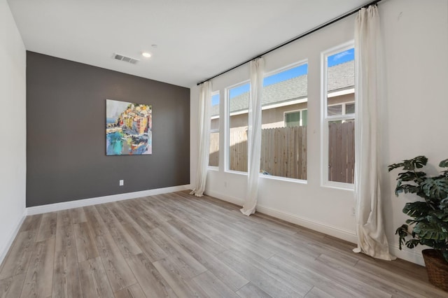 6406 E Giavanna Ave, Fresno, CA 93727 - spare room featuring wood finished floors and recessed lighting