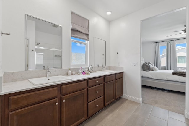 6406 E Giavanna Ave, Fresno, CA 93727 - bathroom with double vanity, a shower stall, ensuite bath, ceiling fan, and tile patterned floors