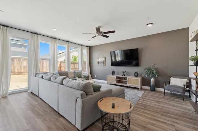 6406 E Giavanna Ave, Fresno, CA 93727 - living room featuring a ceiling fan, wood finished floors, and recessed lighting