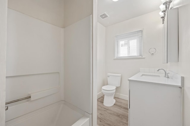 3919 E Butler, Fresno, CA 93702 - bathroom with vanity, wood finished floors, and shower / bath combination