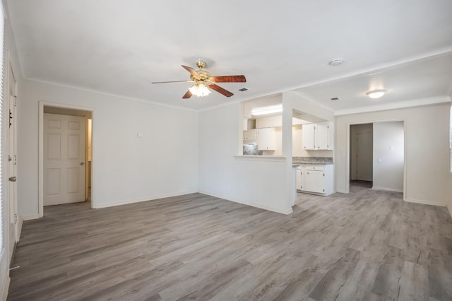 3919 E Butler, Fresno, CA 93702 - unfurnished living room featuring light wood-style floors and ceiling fan
