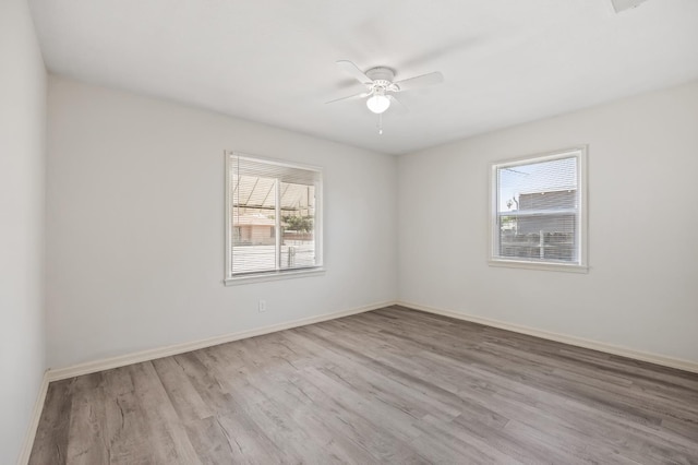 3919 E Butler, Fresno, CA 93702 - spare room featuring healthy amount of natural light, wood finished floors, and a ceiling fan