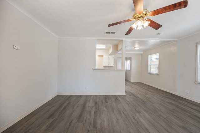 3919 E Butler, Fresno, CA 93702 - unfurnished living room with a ceiling fan, dark wood-style floors, and crown molding