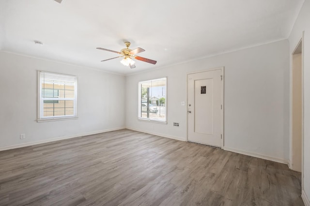 3919 E Butler, Fresno, CA 93702 - spare room with wood finished floors, ceiling fan, and crown molding
