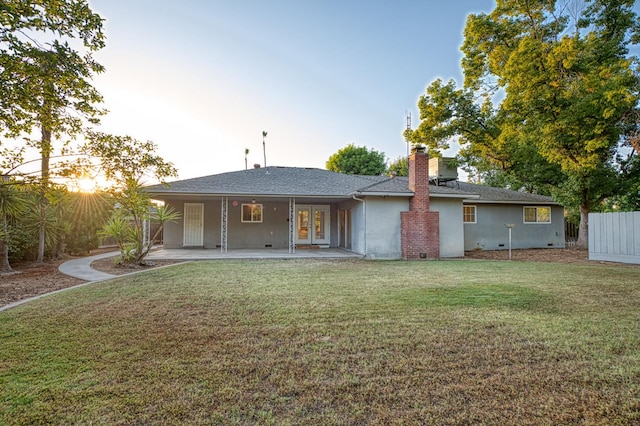 6482 N 5th St, Fresno, CA 93710 - back of house featuring a yard, french doors, a chimney, and stucco siding