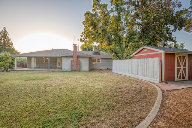 6482 N 5th St, Fresno, CA 93710 - view of yard with a storage unit and a patio area