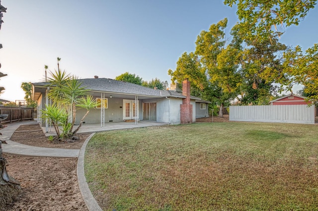 6482 N 5th St, Fresno, CA 93710 - back of house with a chimney, a patio, and french doors