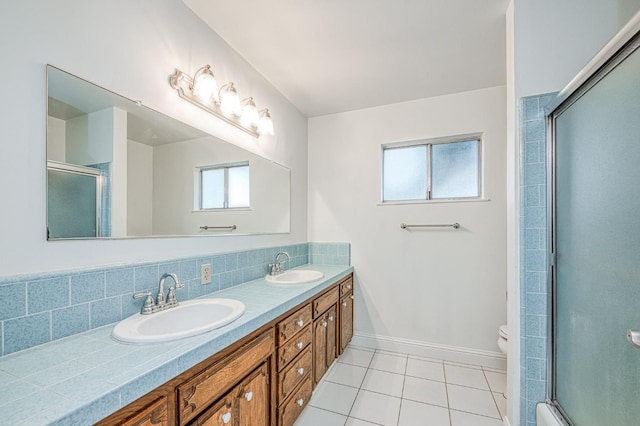 6482 N 5th St, Fresno, CA 93710 - bathroom featuring tile patterned flooring, double vanity, an enclosed shower, and backsplash