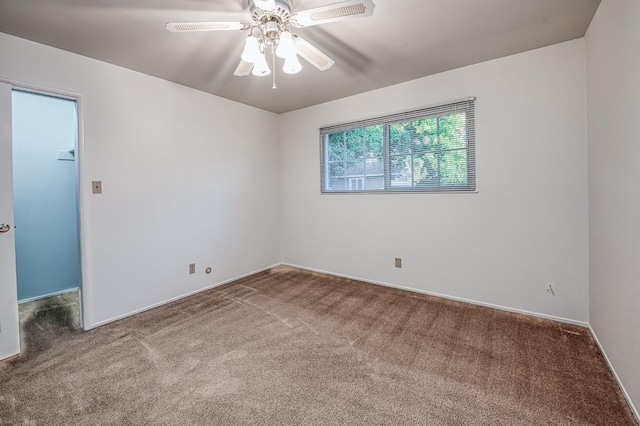 6482 N 5th St, Fresno, CA 93710 - carpeted empty room with ceiling fan and baseboards