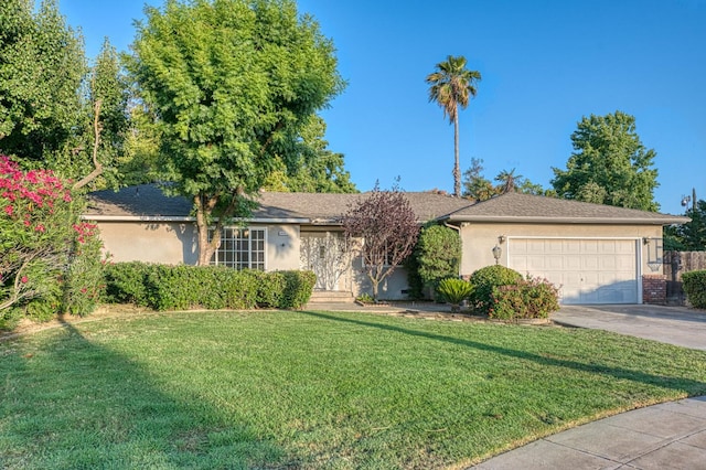 6482 N 5th St, Fresno, CA 93710 - ranch-style house with driveway, stucco siding, a front yard, and an attached garage