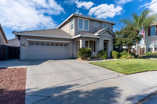 1085 Stanford Ave, Madera, CA 93637 - traditional-style house with stucco siding, concrete driveway, a garage, and a tile roof