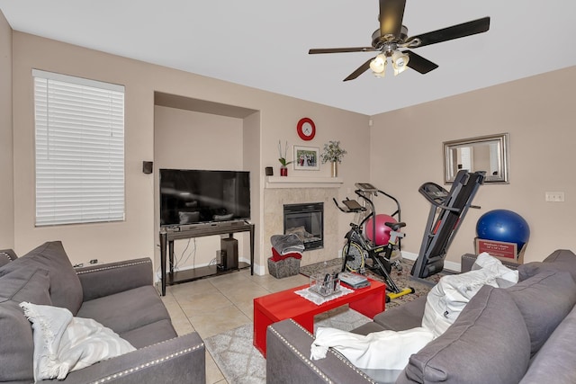 1085 Stanford Ave, Madera, CA 93637 - living room with ceiling fan, a fireplace, and light tile patterned flooring