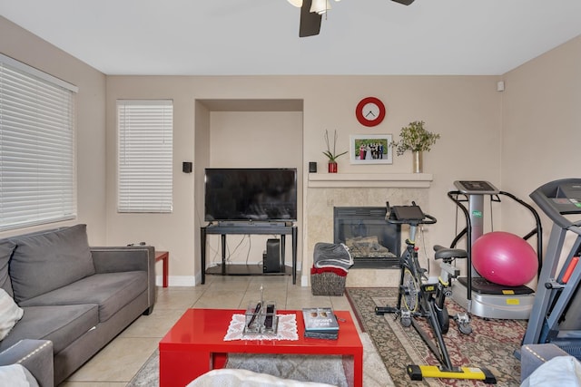 1085 Stanford Ave, Madera, CA 93637 - tiled living room featuring a tile fireplace and ceiling fan