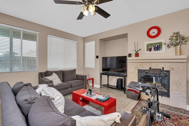 1085 Stanford Ave, Madera, CA 93637 - living room featuring a ceiling fan, tile patterned flooring, and a tiled fireplace