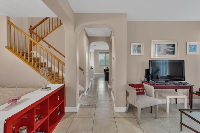 1085 Stanford Ave, Madera, CA 93637 - hall with stairway, arched walkways, and tile patterned floors