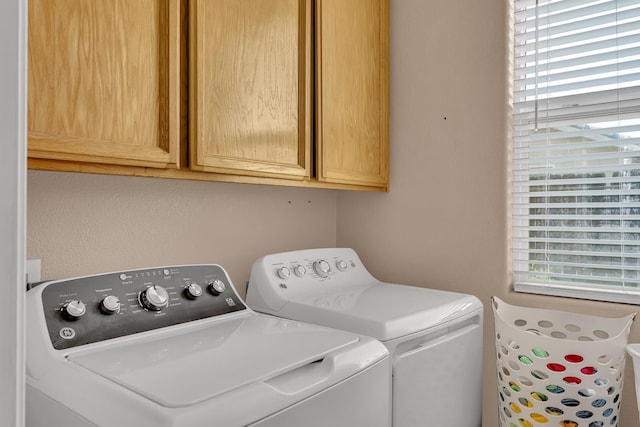 1085 Stanford Ave, Madera, CA 93637 - laundry area featuring independent washer and dryer and cabinet space
