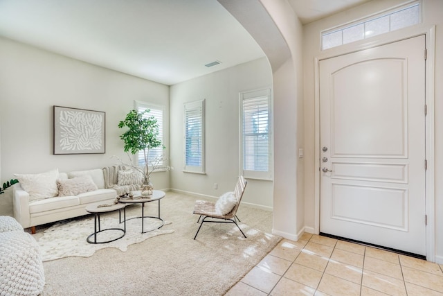 3202 Everglade Ave, Clovis, CA 93619 - foyer with arched walkways, healthy amount of natural light, and light tile patterned floors
