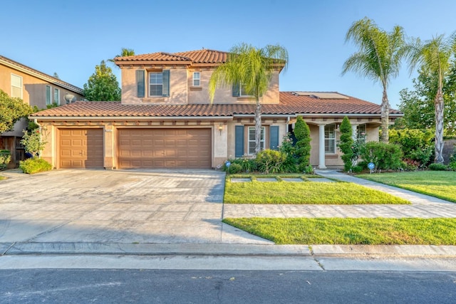 3202 Everglade Ave, Clovis, CA 93619 - mediterranean / spanish home featuring stucco siding, a front yard, and a tile roof