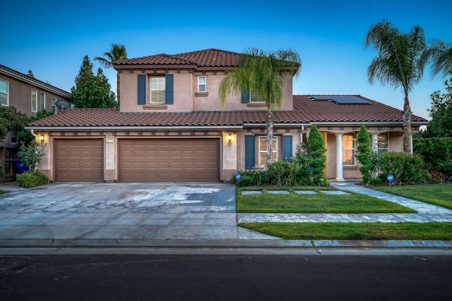 3202 Everglade Ave, Clovis, CA 93619 - view of front of home featuring stucco siding, solar panels, a tile roof, a front yard, and driveway