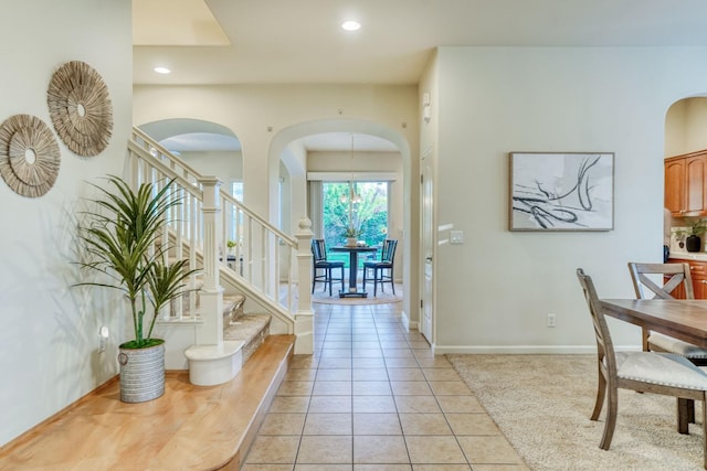 3202 Everglade Ave, Clovis, CA 93619 - foyer with arched walkways, stairway, light tile patterned floors, and recessed lighting