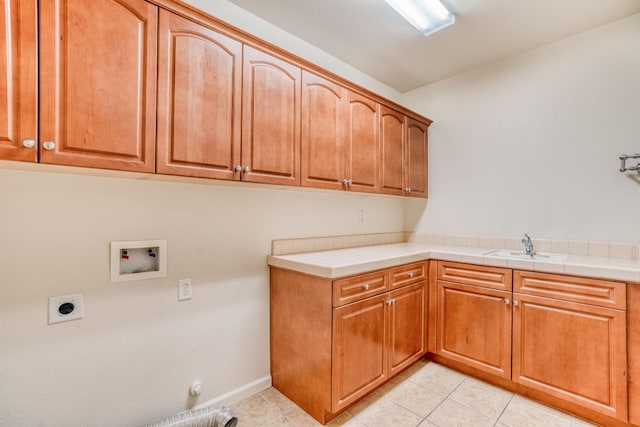 3202 Everglade Ave, Clovis, CA 93619 - laundry room featuring cabinet space, hookup for a washing machine, electric dryer hookup, gas dryer hookup, and light tile patterned floors