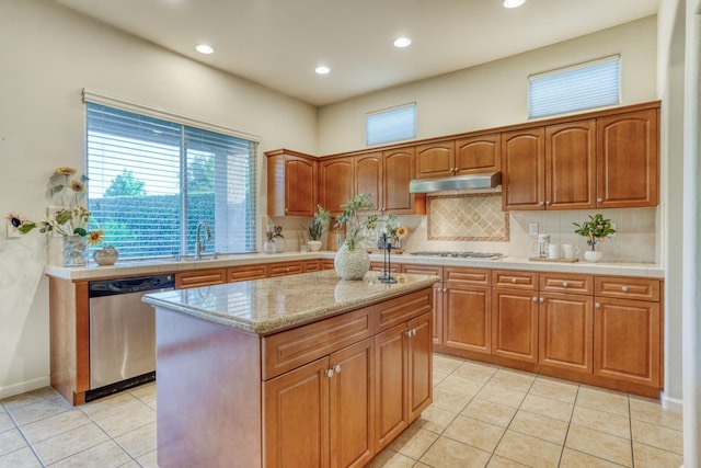 3202 Everglade Ave, Clovis, CA 93619 - kitchen featuring dishwasher, under cabinet range hood, white gas stovetop, light tile patterned floors, and tasteful backsplash