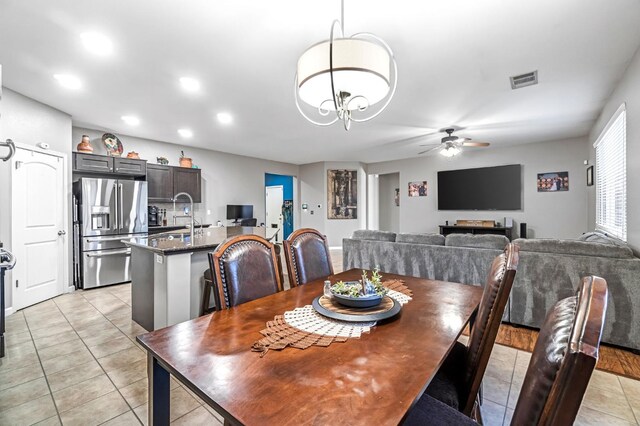 976 Daisy Ct, Dinuba, CA 93618 - dining space with light tile patterned floors, ceiling fan, and recessed lighting