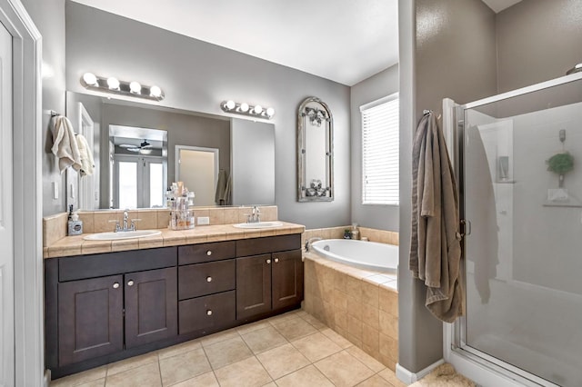 976 Daisy Ct, Dinuba, CA 93618 - bathroom with a stall shower, a bath, tile patterned flooring, double vanity, and ceiling fan