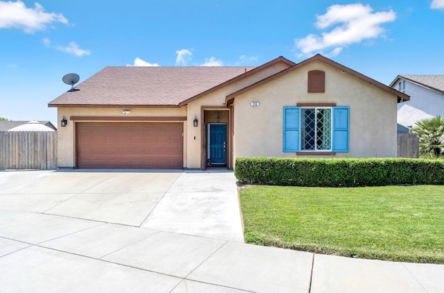 976 Daisy Ct, Dinuba, CA 93618 - view of front of house with a garage, driveway, and stucco siding